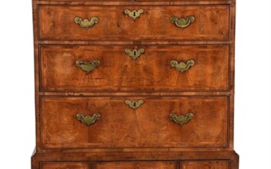 A GEORGE I WALNUT AND FEATHER BANDED CHEST ON STAND, CIRCA 1720