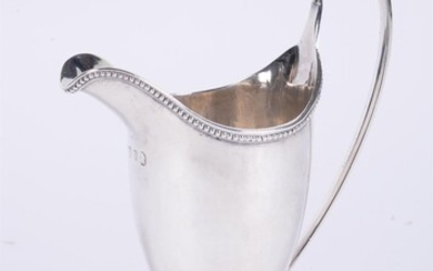 A George III silver helmet shaped cream jug by Charles Hougham