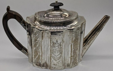 A George III silver teapot, etched decoration of