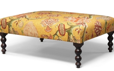 A George Smith contemporary floral upholstered footstool, large proportions, the fabric with a foliage pattern on a golden ground, raised on bobbin turned supports, 38cm high, 100cm wide, 75cm deep