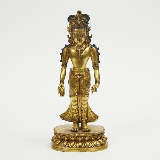 A Gilt Bronze Standing Buddha