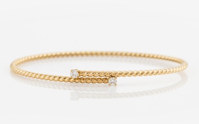 A Kiki McDonough bracelet in 18K gold with round brilliant-cut diamonds