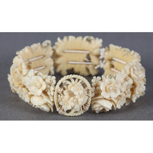 A LATE 19TH/EARLY 20TH CENTURY IVORY PANEL BRACELET of eight...