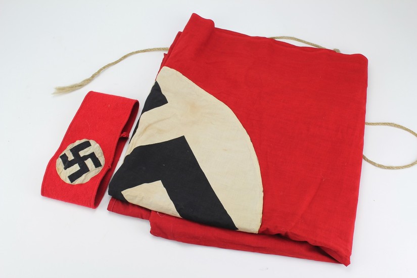 A Nazi red and white circular linen flag, black printed swas...