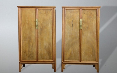 A PAIR OF CHINESE HARDWOOD ROUND-CORNERED TAPERED CABINETS, YUANJIAOGUI. Qing Dynasty. The rounded projecting four frame members set above the rectangular recessed top panel, joined by four round posts at each corner forming the tapered silhouette...