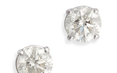 A PAIR OF DIAMOND STUD EARRINGS in 18ct white gold, each set with a round brilliant cut diamond, the