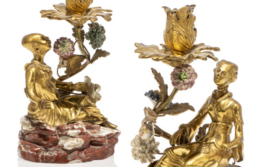 A PAIR OF FRENCH ORMOLU AND PORCELAIN 'MAGOT' CANDLESTICKS SECOND HALF 19TH CENTURY, THE PORCELAIN FLOWERS 18TH CENTURY AND LATER