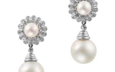 A PAIR OF PEARL AND DIAMOND DROP EARRINGS each set with a pearl accented by single cut diamonds, ...