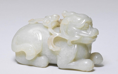 A PALE GREEN JADE CARVING OF A MYTHICAL BEAST 17th/18th...