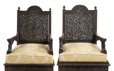 A Pair of Burmese Carved Hardwood Armchairs