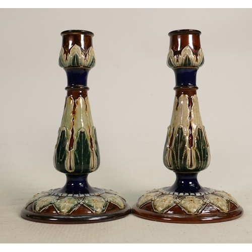 A Pair of Doulton Lambeth candlesticks: Decorated with flowe...