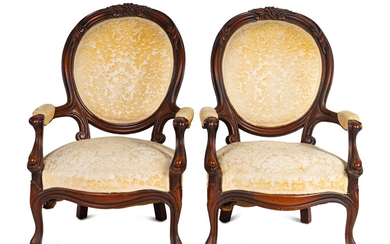 A Pair of Rococo Revival Carved Walnut Fauteuils