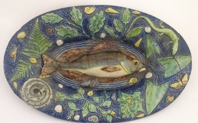 A 19thC French Palissy ware majolica dish of oval form