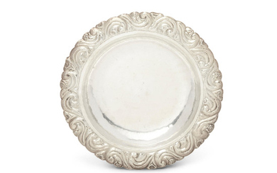 A Peruvian sterling silver bowl with repousse border