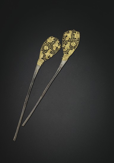A RARE PAIR OF PARCEL-GILT SILVER HAIRPINS, TANG DYNASTY (AD 618-907)