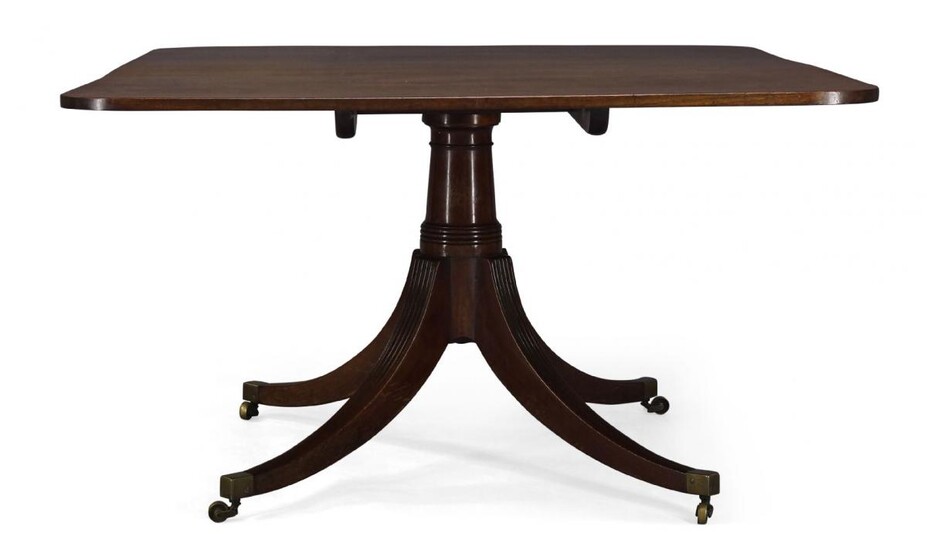 A Regency mahogany tilt top breakfast table, the rounded rectangular...