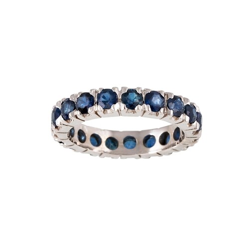 A SAPPHIRE ETERNITY RING, set with circular stones, mounted ...