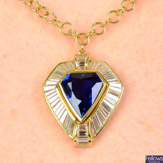 A Sri Lankan sapphire and diamond pendant, on chain.