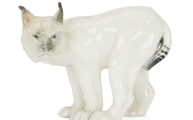 A Swedish RÃ¶rstrand white porcelain lynx, circa 1960, with maker's mark to underside of foot, 15.8cm high, 20.3cm wide Provenance: a wedding gift from Keith Wedmore to Sir Nicholas and Lady Judith Goddison, 18 June 1960.