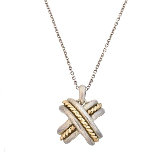 A Tiffany & Co. silver and gold cross pendant