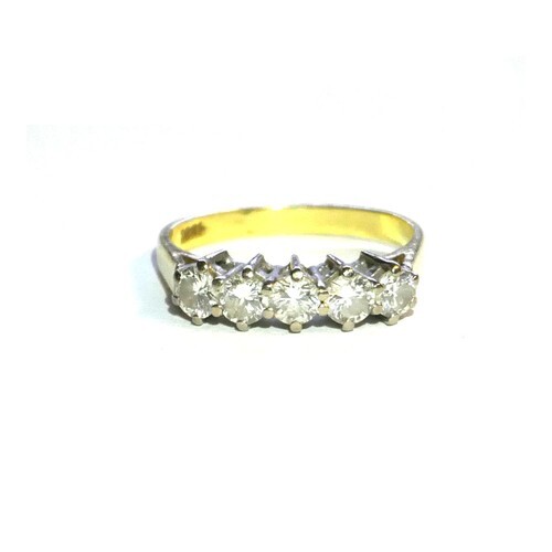 A VINTAGE 18ct GOLD AND DIAMOND FIVE STONE RING A single row...