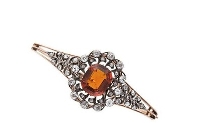 A Victorian citrine and diamond bangle, with detachable centrepiece, central claw set octagonal