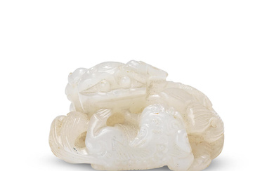 A WHITE JADE 'BUDDHIST LIONS' GROUP CARVING 18th/19th century