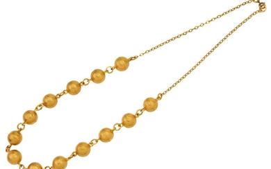 A bead necklace with chain link back chain, Egyptian marks, to a gilt clasp, length 52cm, approximate gross weight 26g