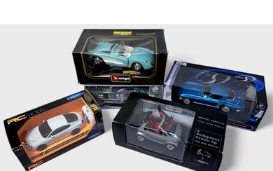A collection of seven boxed assorted die-cast 1:18 scale mod...