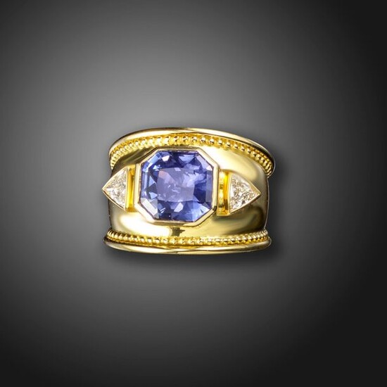 A colour change sapphire and diamond ring, the octagonal sapphire...