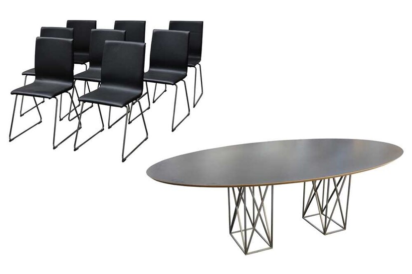 A contemporary dining table by Live Iconic and eight dining chairs
