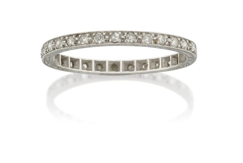 A diamond eternity ring, claw set with a single row of brilliant-cut diamonds, ring size approx. N