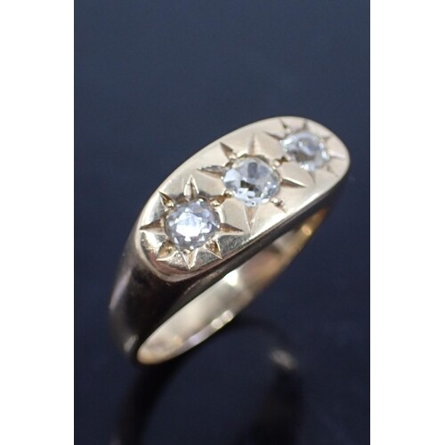A diamond three stone ring set in 9ct gold finger size T