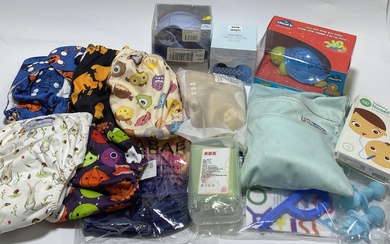 A group of baby items including reusable nappies, night light etc.
