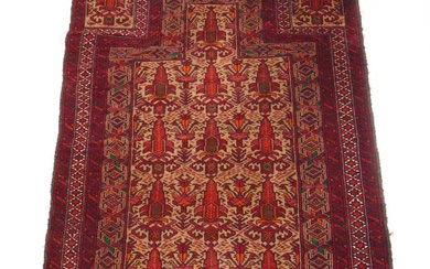 A handwoven Persian prayer rug, the multi line border surrounding...