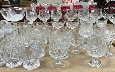 A large collection of cut glass wines and beakers...