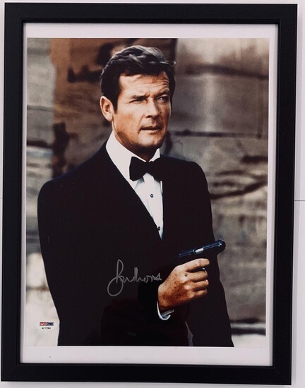 SOLD. A large signed colour still photograph of the English actor Sir Roger Moore in his role as James Bond. Photo size 35 x 28 cm. Framed. – Bruun Rasmussen Auctioneers of Fine Art
