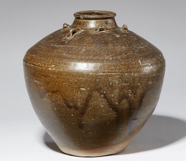 A large stoneware storage jar. 13th-15th century