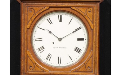 A late 19th century American oak wall timepiece, 31cm circul...