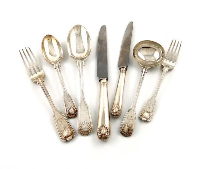A matched Victorian silver Fiddle, Thread and Shell pattern canteen for twelve, the majority by Aldewinckle and Slater, London 1893, and later pieces Sheffield 1931, most with crests to the terminals, comprising eighteen table forks, ten dessert forks...