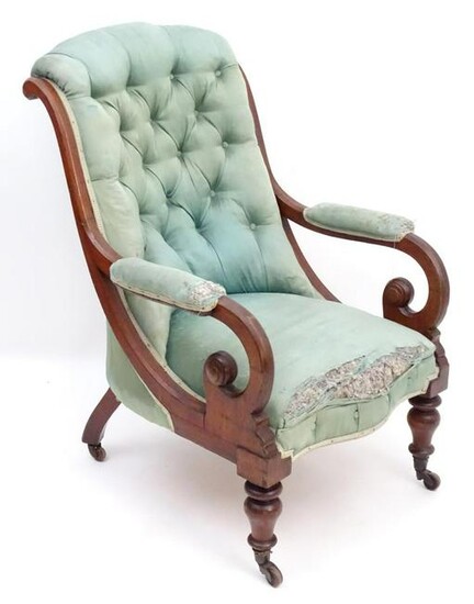 A mid / late 19thC mahogany armchair with a shaped deep