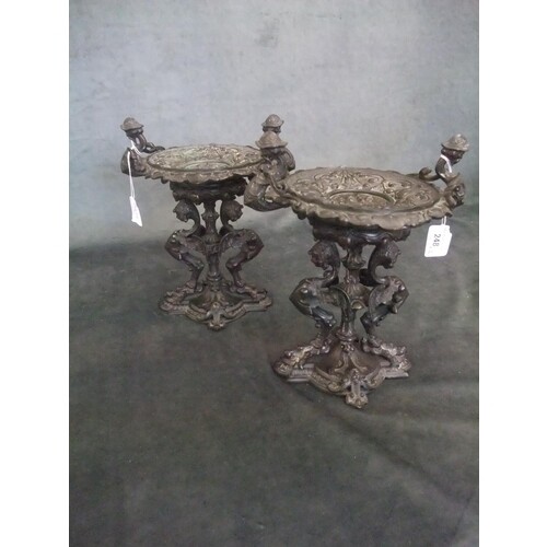 A pair of 20th century bronzed tazzas on stands in the form ...