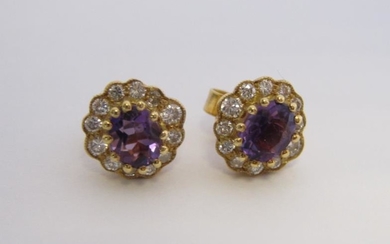A pair of Amethyst and Diamond Cluster Earrings each...