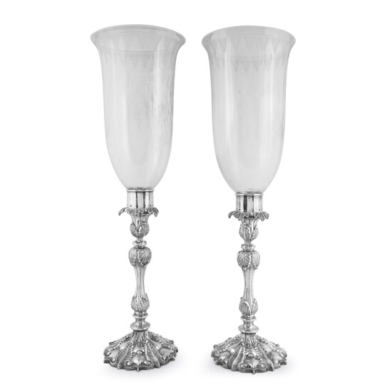 A pair of Chinese silver candlesticks with etched glass hurricane shades 19th/early 20th century