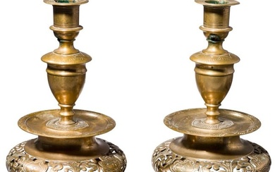 A pair of German pierced bell-bottom candlesticks in the Nuremberg style of the 17th century, circa