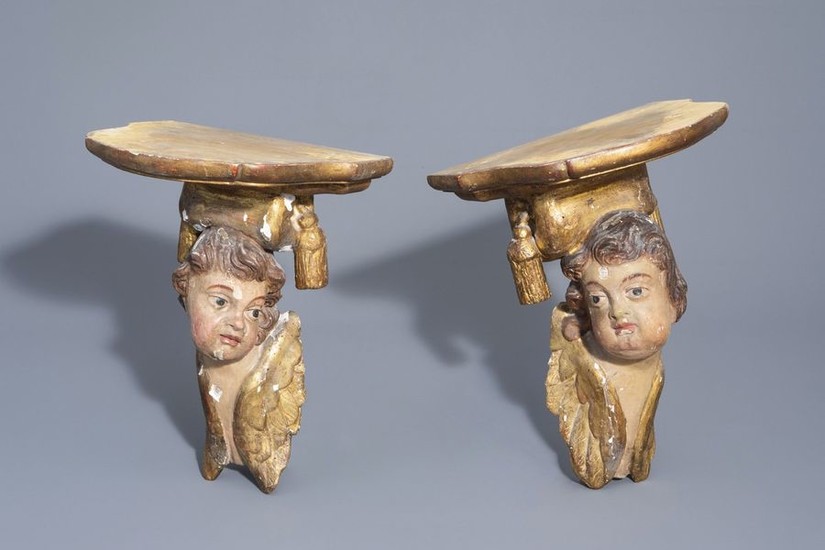 A pair of German polychrome painted and gilt...
