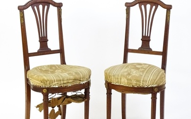 A pair of Louis Phillipe mahogany side chairs with pierced, ...