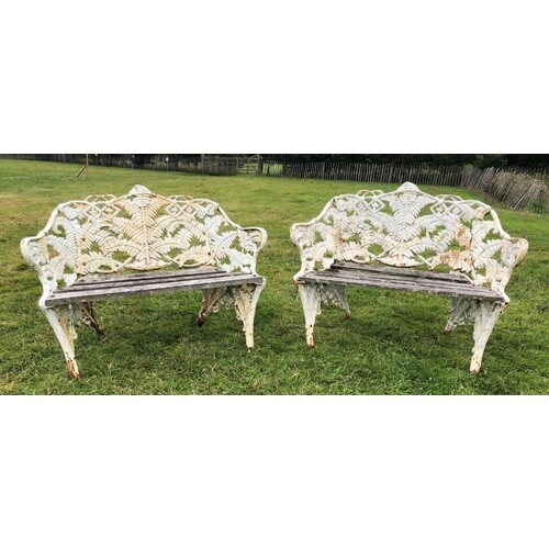 A pair of cast iron ‘fern’ pattern garden benches, in Coalbr...