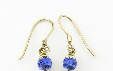 A pair of silver gilt drop earrings set with tanzanites. App...