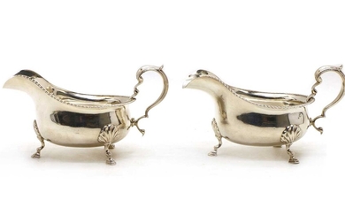 A pair of silver sauceboats
